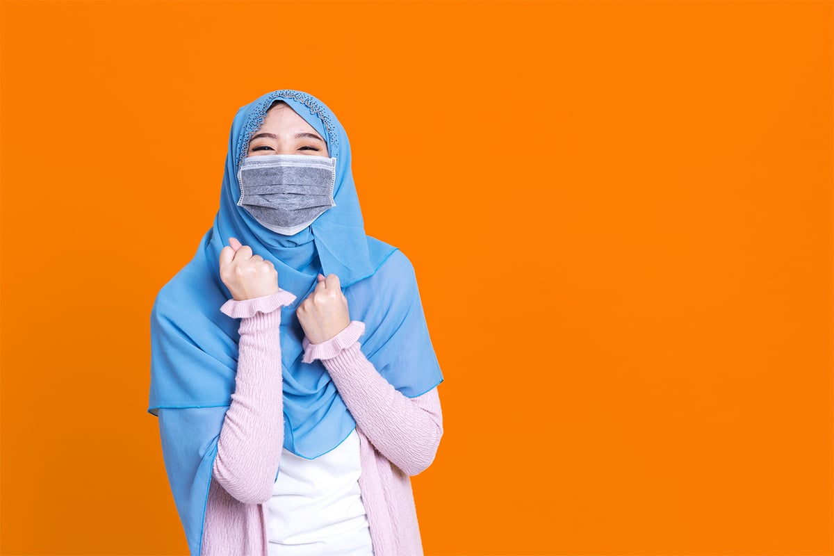 Woman with hijab wearing mask
