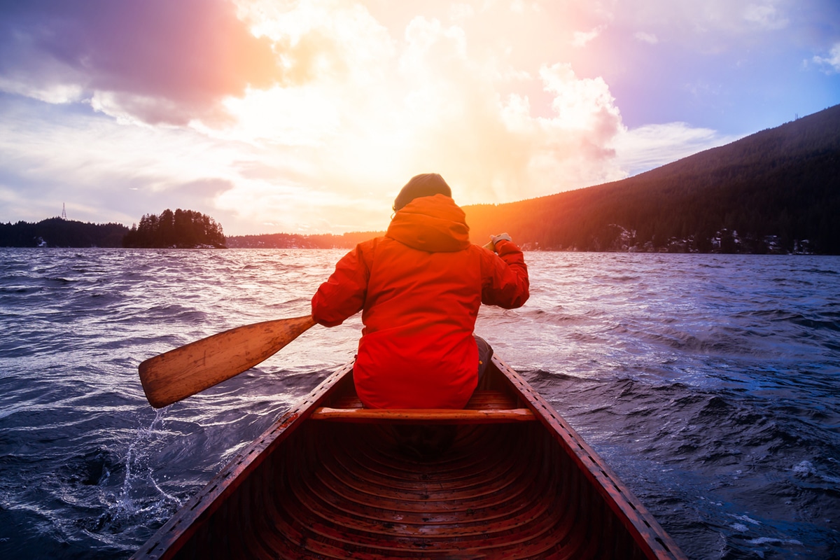 Winter canoeing into the sunset