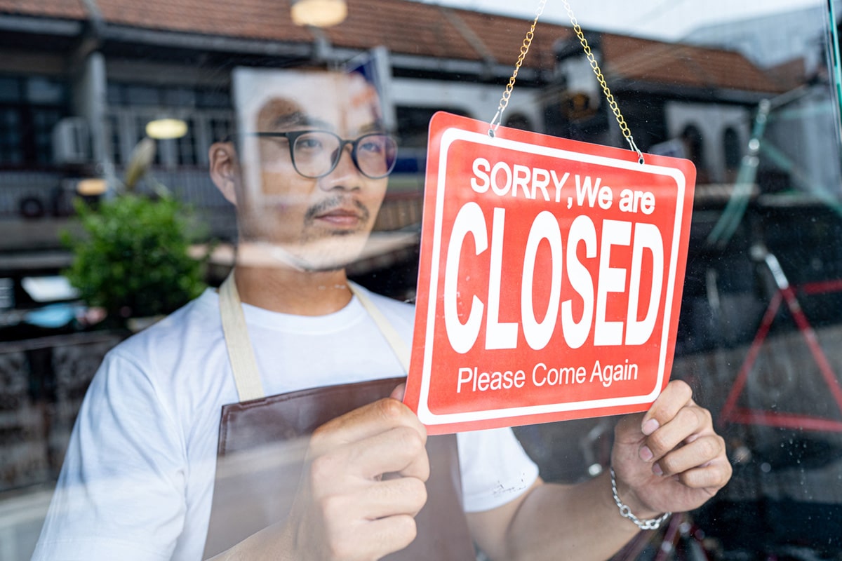 Store owner closing shop