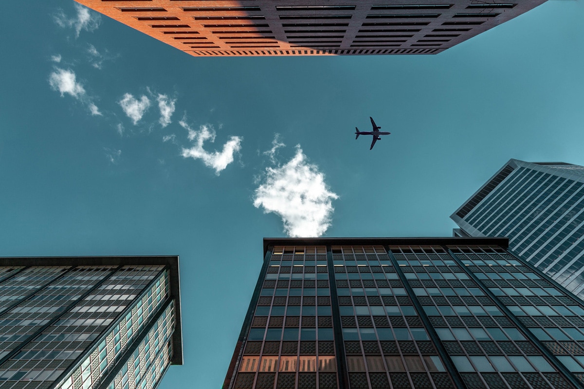 Airplane flying in blue sky