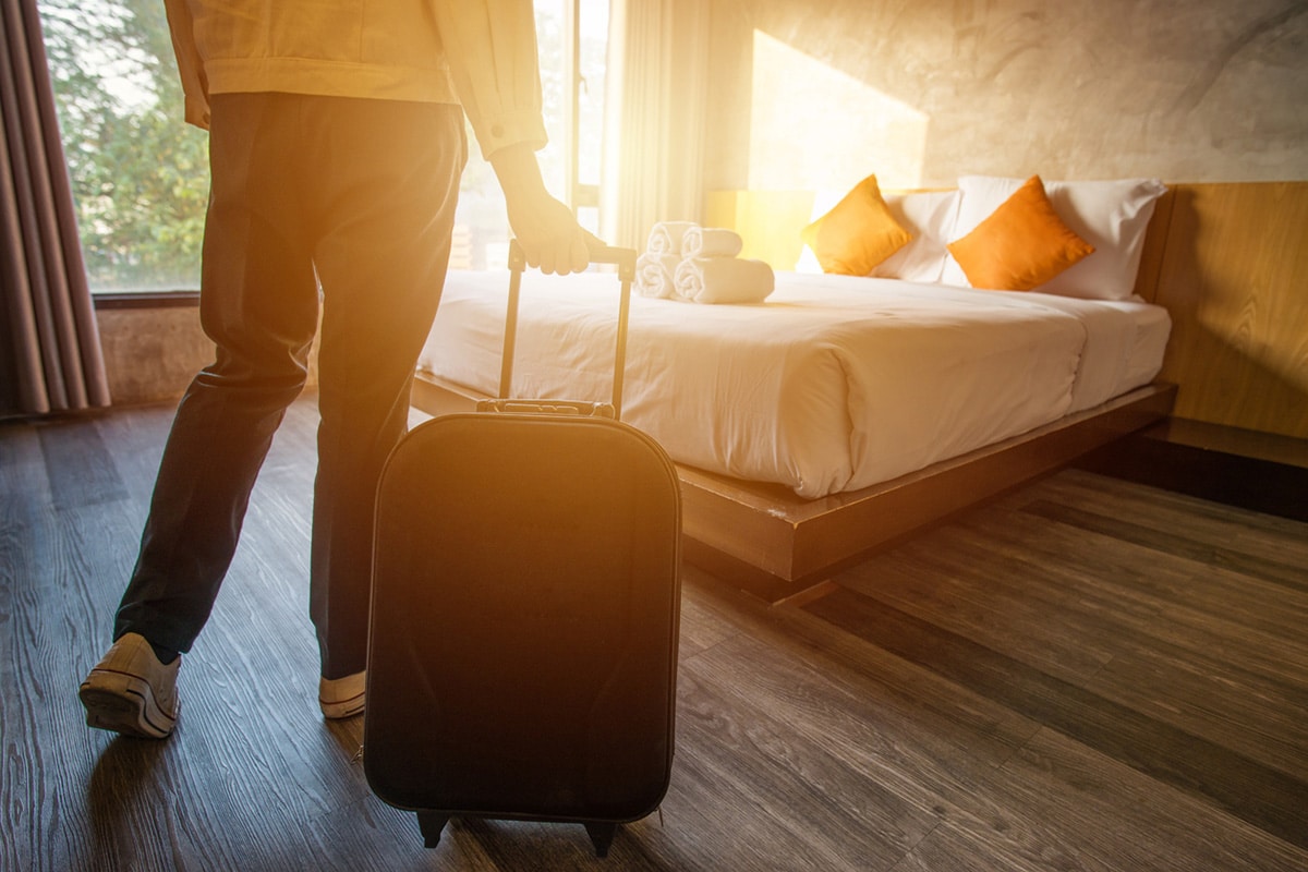 Person checking in solo to a hotel room.