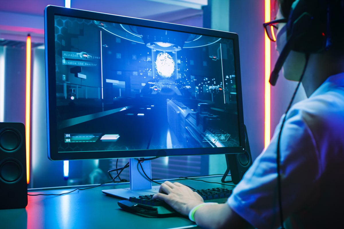 Person playing video games in high tech room.