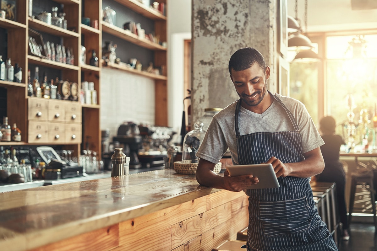 Business owner working on tablet.