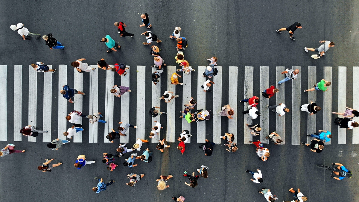 Aerial view of people crossing the street