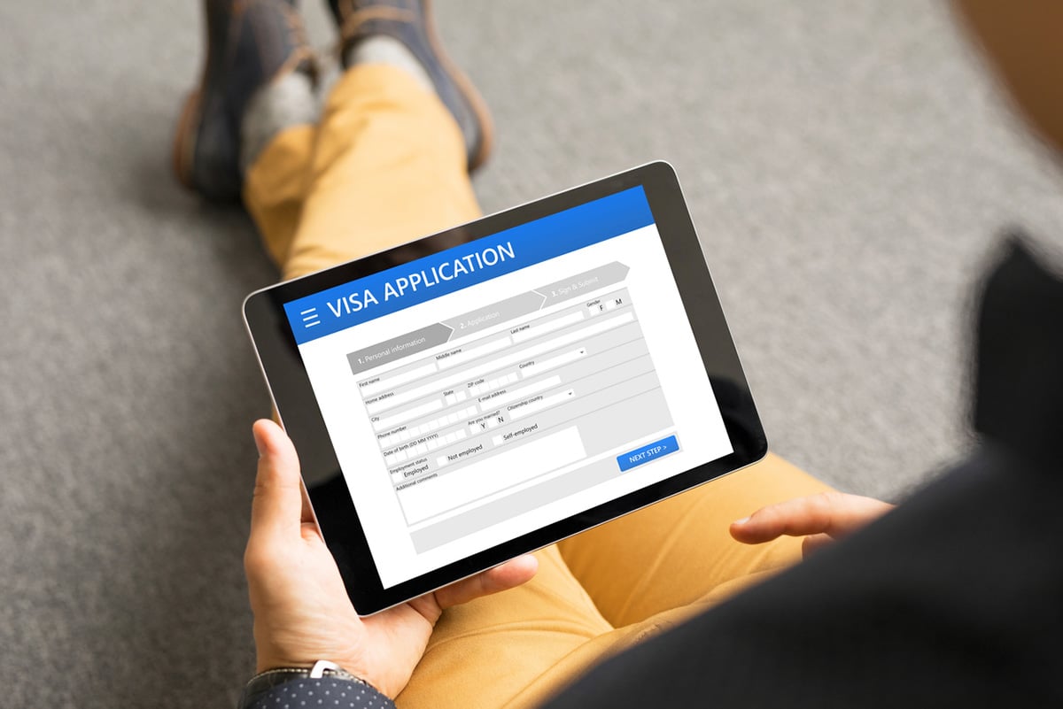 Tablet open to "Visa Application" webpage