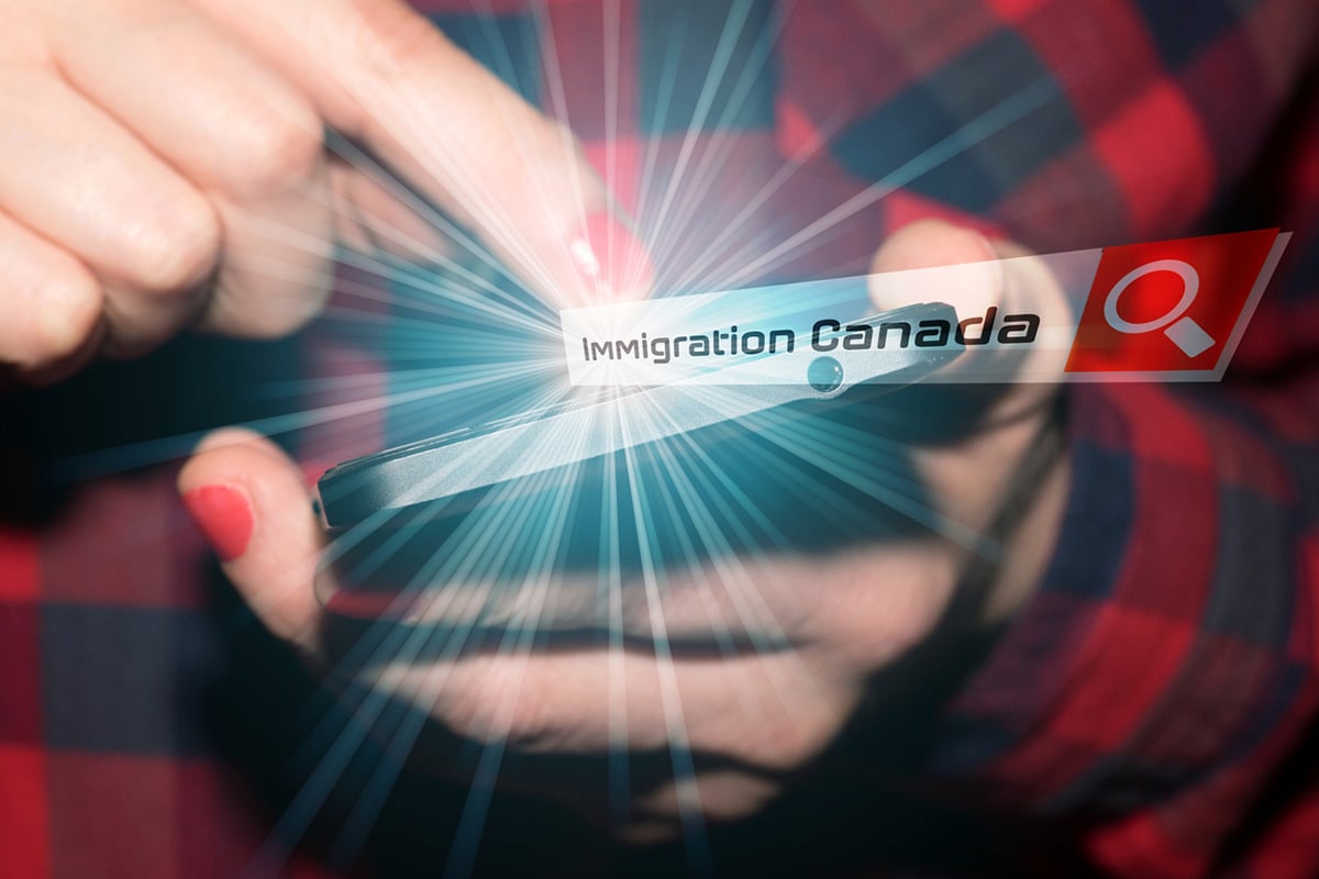 Person applying for Canadian immigration on a cell phone