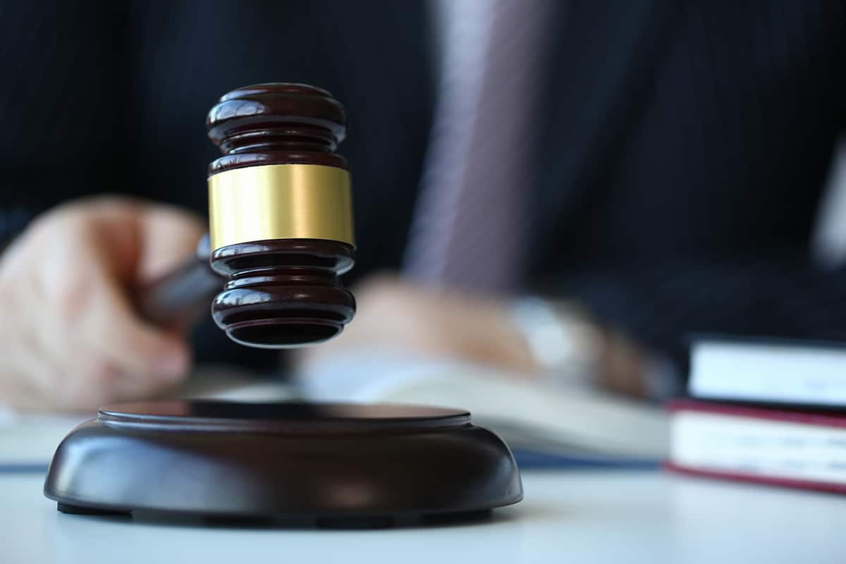 Judge hitting a gavel.