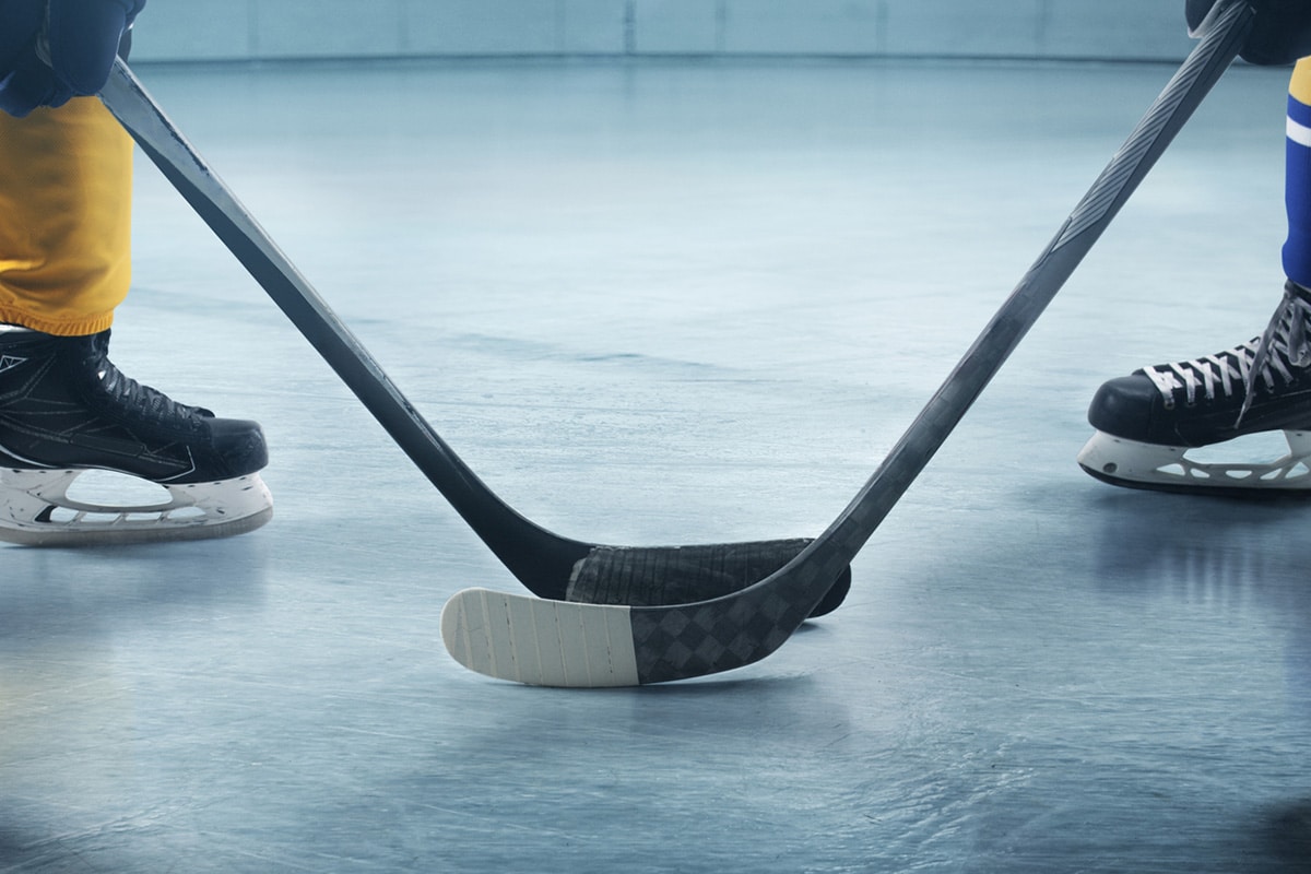 Hockey players facing off on the ice