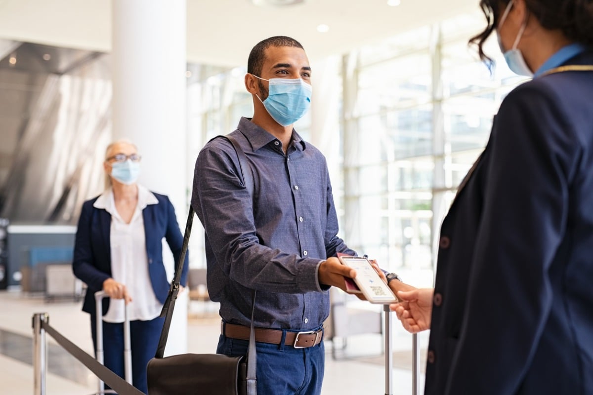 Travellers at an airport during COVID-19 pandemic