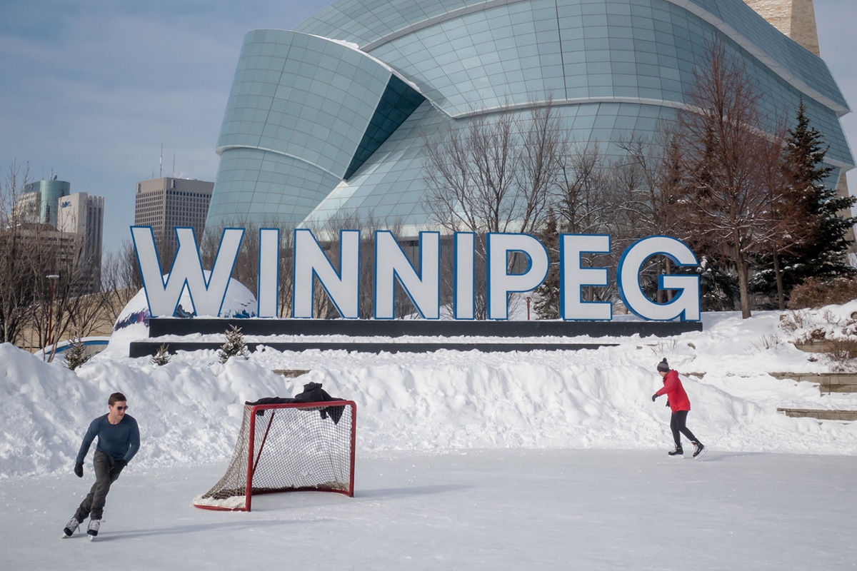 Two people skating outside the Human Rights museum in Winnipeg