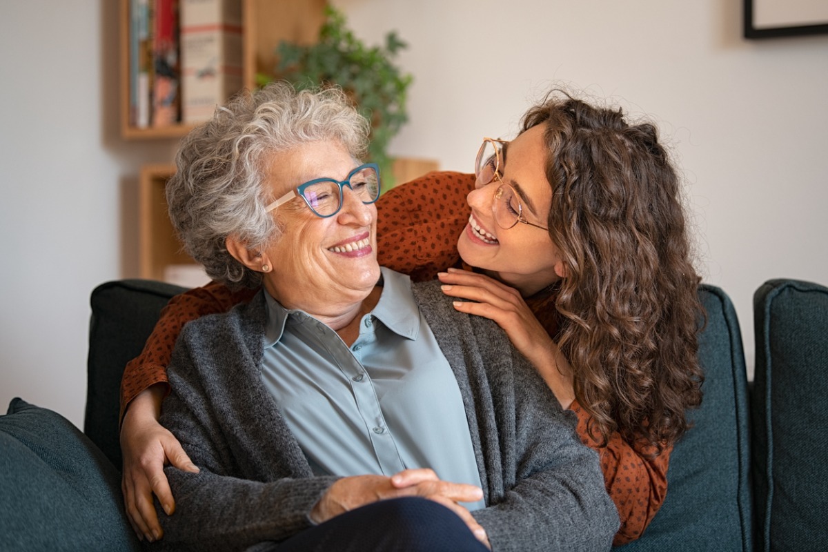 Grandmother and granddaughter share a laugh.