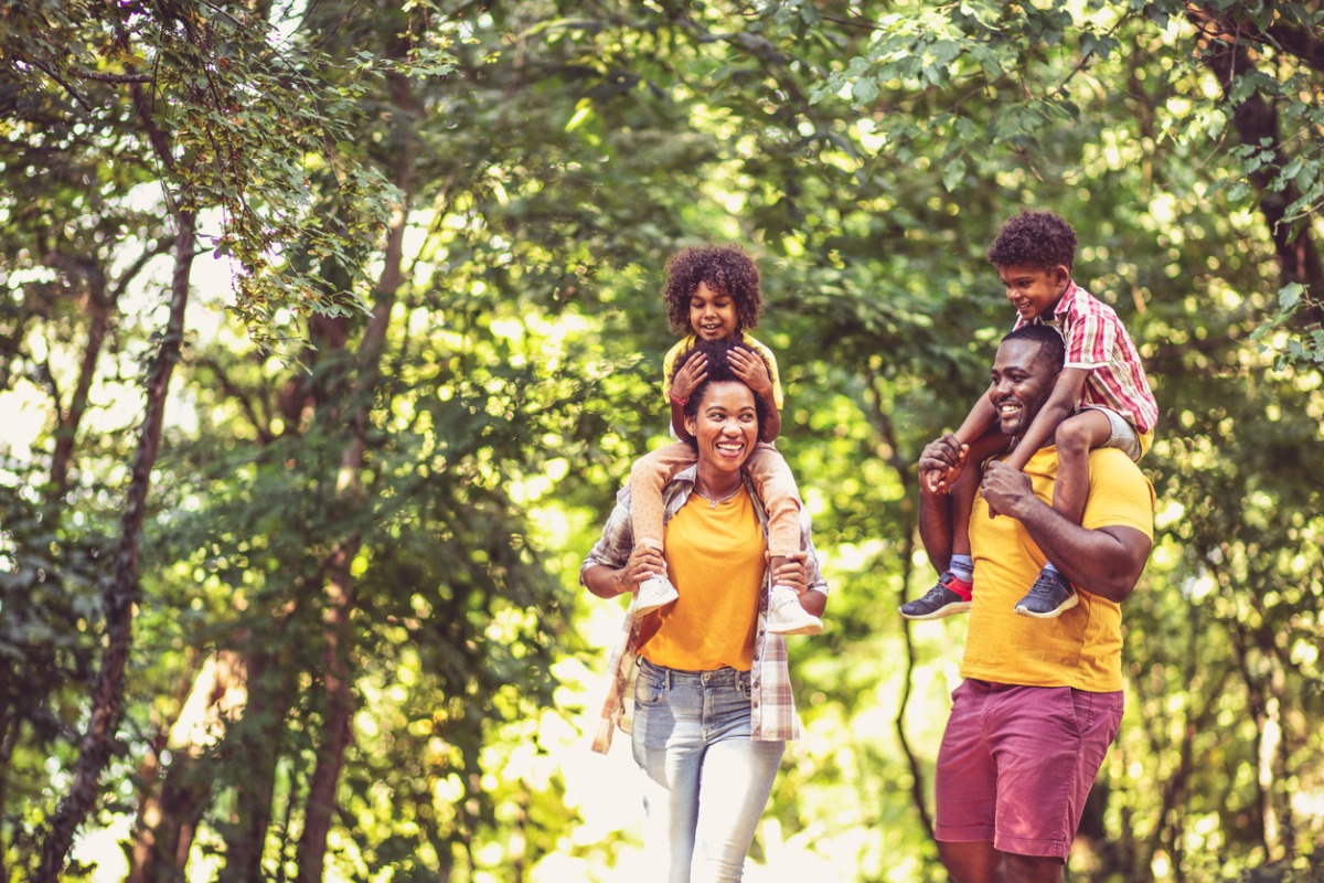 Family walking through woods