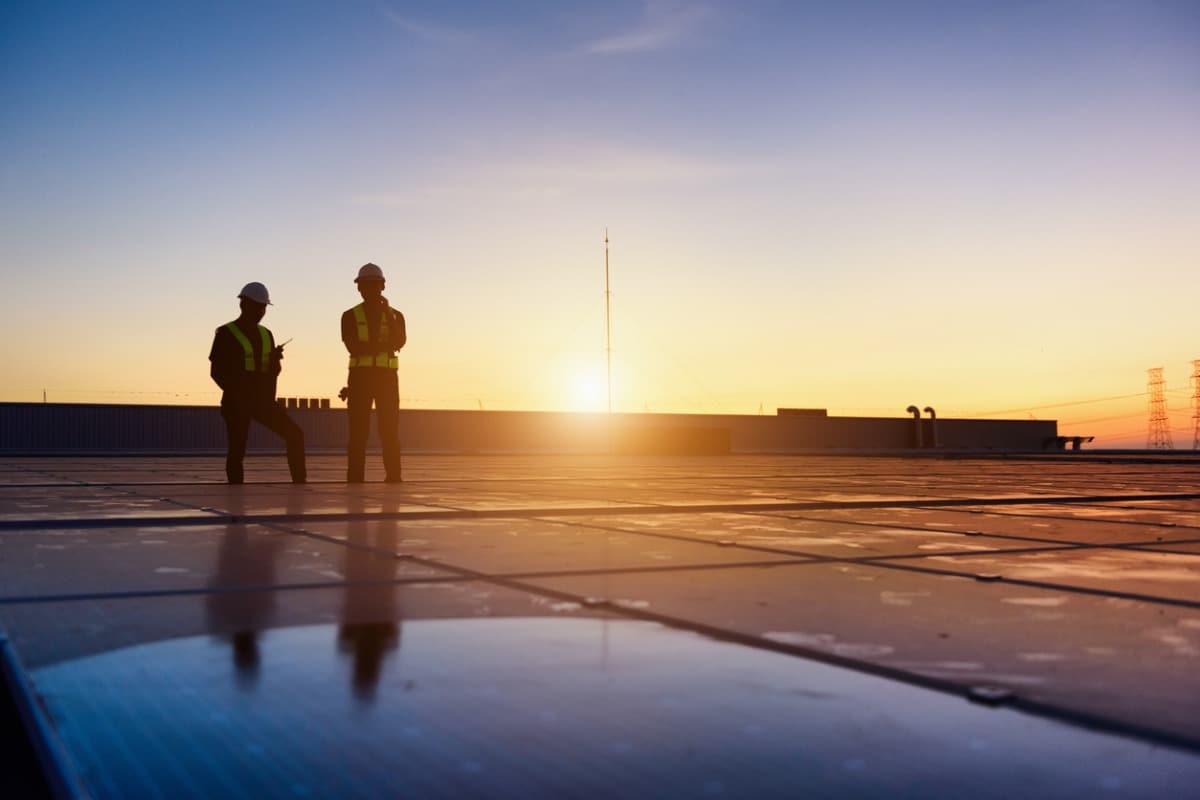 Two engineers working on solar panels.