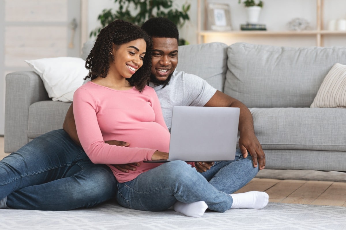 Couple using a laptop at home