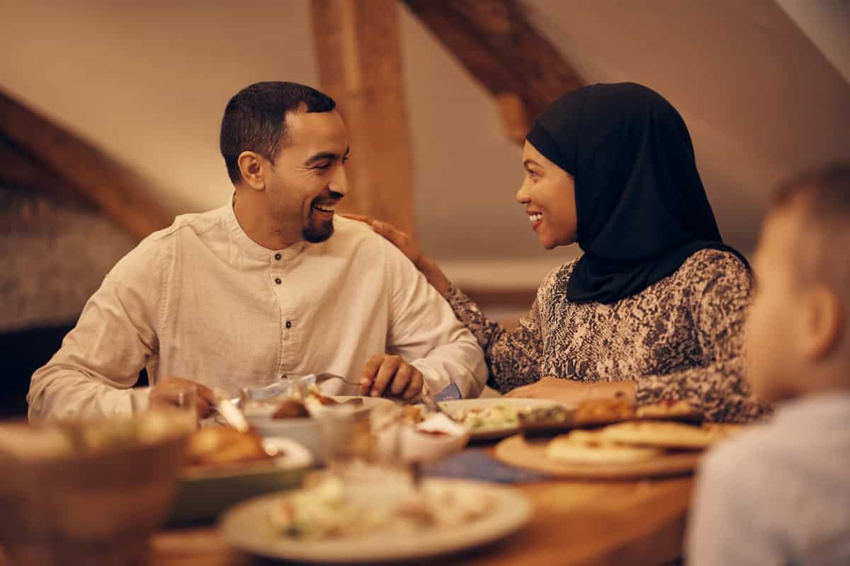 Muslim family eating together
