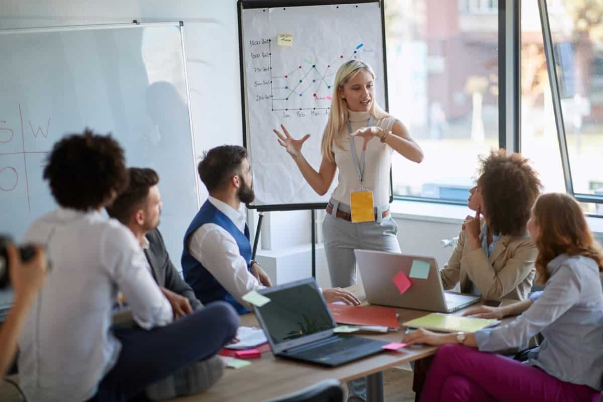 Woman presenting to coworkers