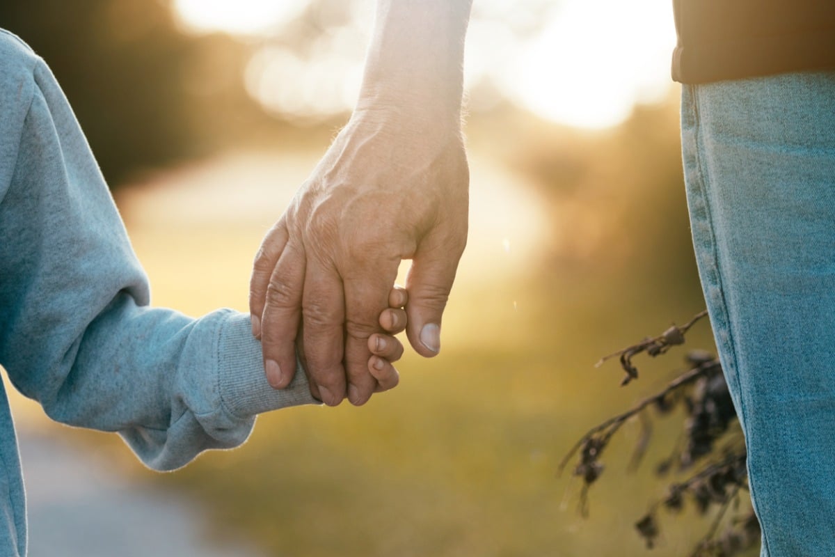 Holding grandpa's hand