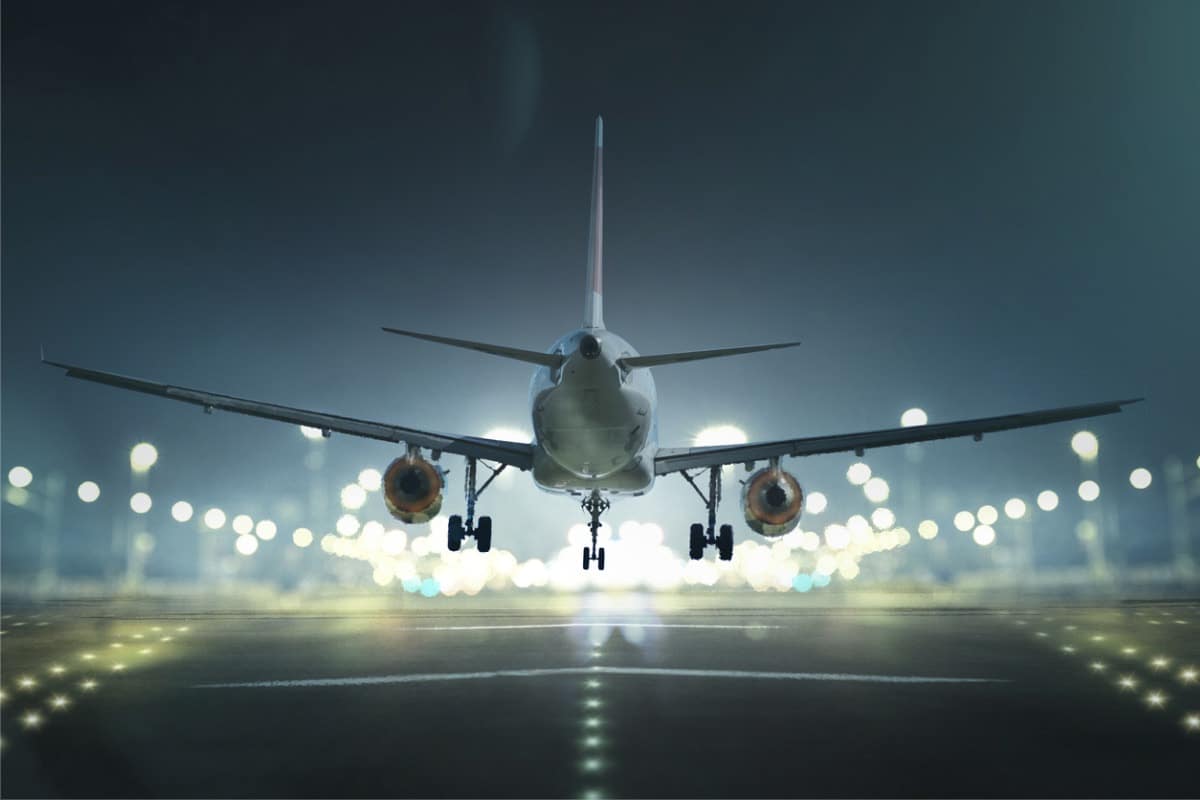 airplane landing on landing strip