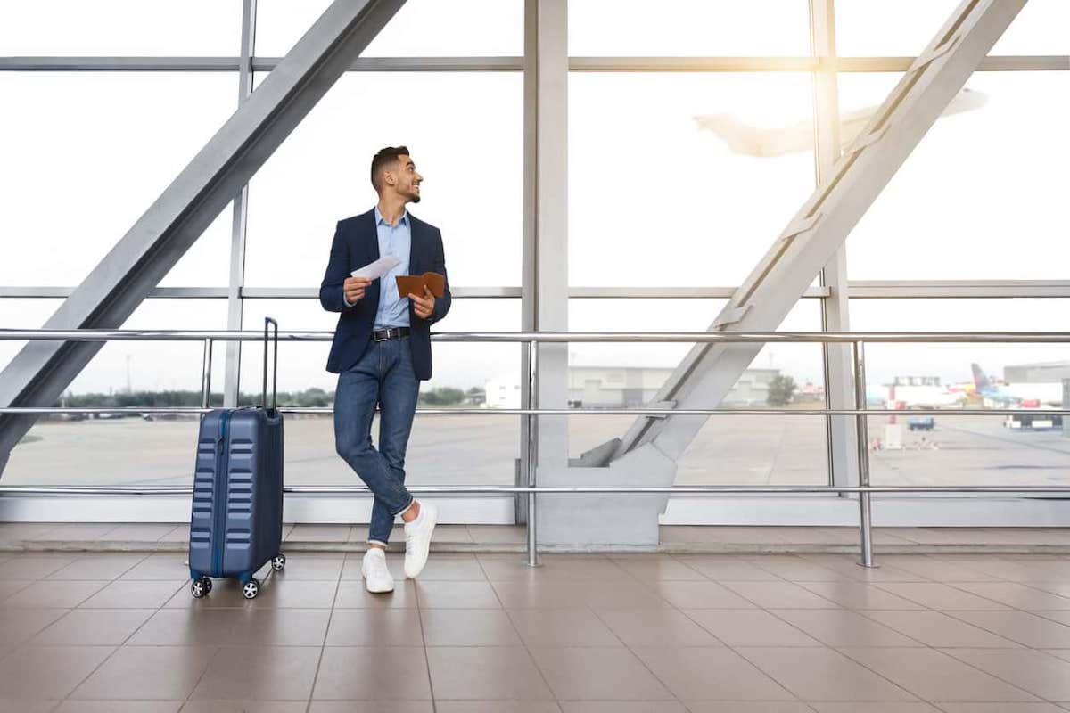 Picture of a man in an airport looking at a plane. Canada permits dual citizenship with other countries, meaning that depending on where immigrants come from, they will be able to hold two passports