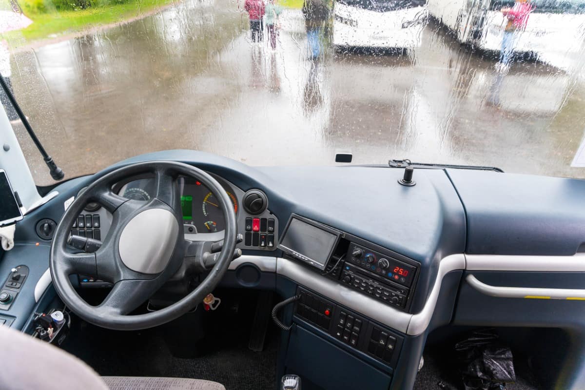 View of the dashboard and steering wheel of a tourist bus