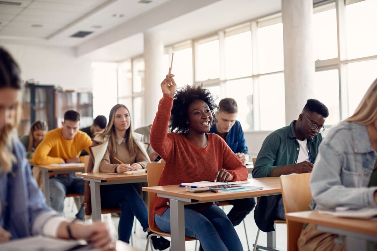Student raising hand in class