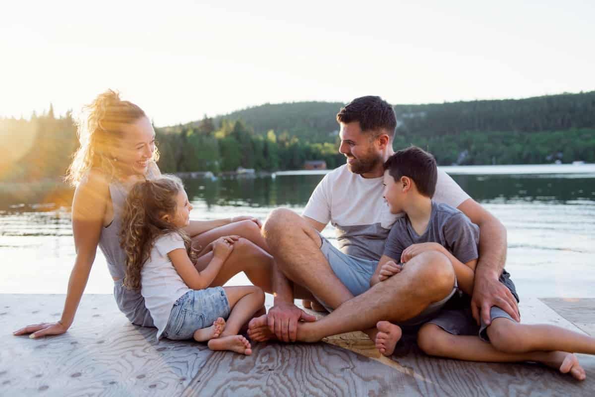 family on dock of lake
