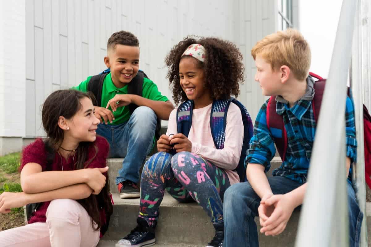 school kids sitting on the stairs
