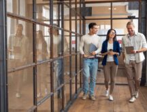 A group of young officer workers walk down a corridor. Canada has opened the IEC pool for 2024, allowing youth from multiple countries to arrive and work here.