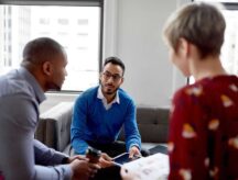 A multi-ethnic group of people brainstorming on a project. Canada's November LFS shows yet more persistent labour shortages.