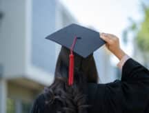 A happy graduate at their graduation ceremony