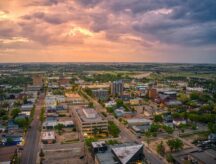 An aerial view of the city of Brandon, Manitoba at sunset.