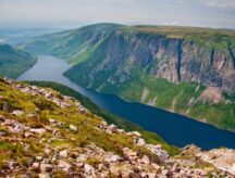 A picture of a gorge with a river running through it in N&L