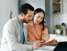 A young couple doing paperwork together