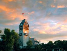 A tower with the Canadian flag on top of it, in the heart of Manitoba
