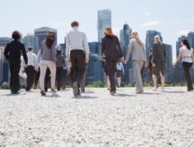 People in corporate attire walking away