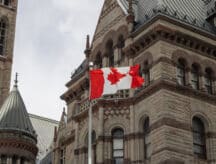 The Canadian flag in front of Toronto former city hall